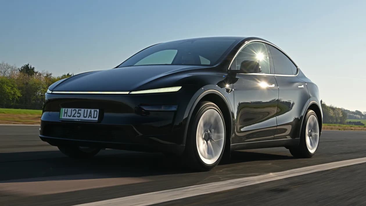 Black Tesla Model Y on the road