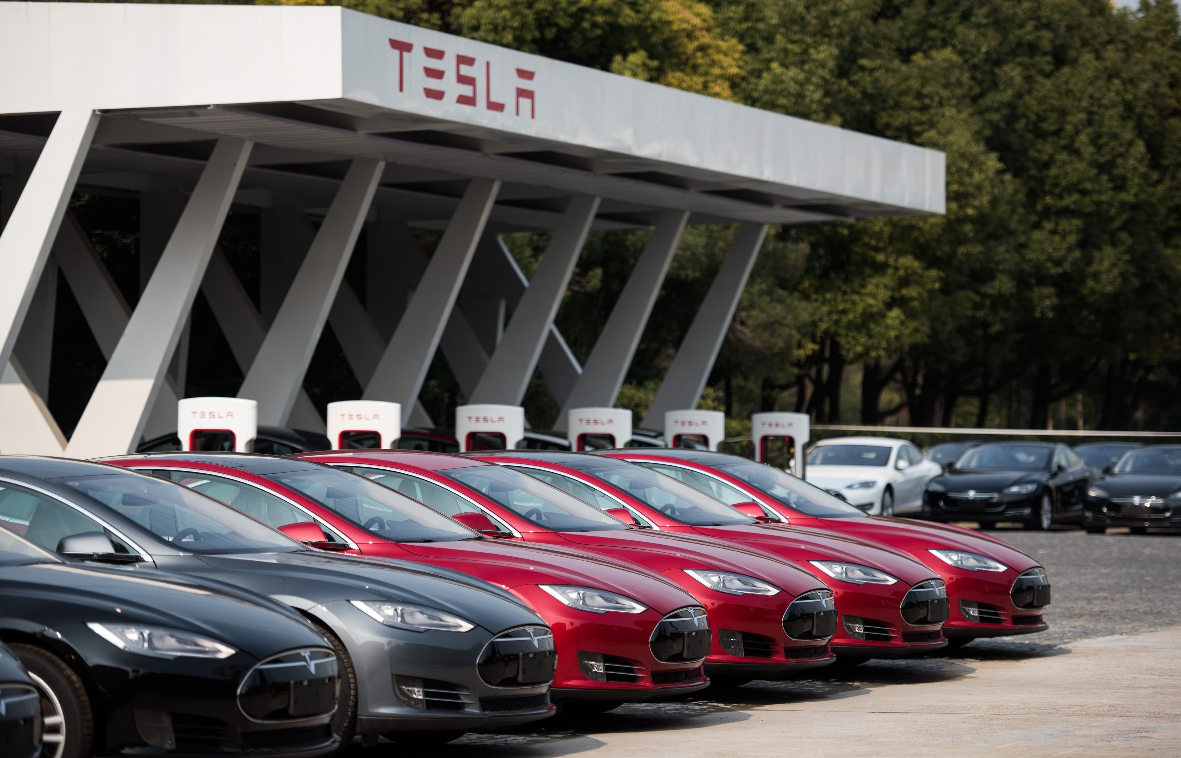 Tesla vehicle lineup outside a showroom